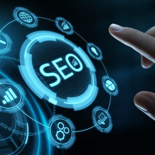 design with SEO and finger of a person on it